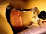 pumped pussy lips in a tight, flat glass tube